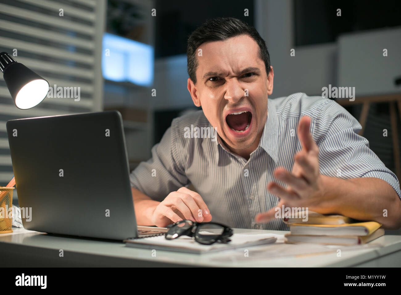 pleasant-male-employee-losing-control-stock-photo-alamy