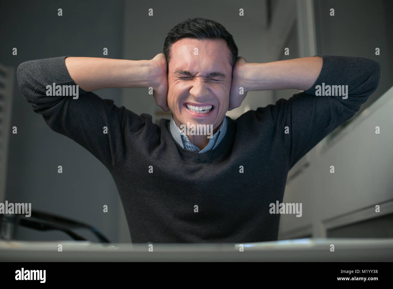 Mad vulnerable man protecting from stress Stock Photo