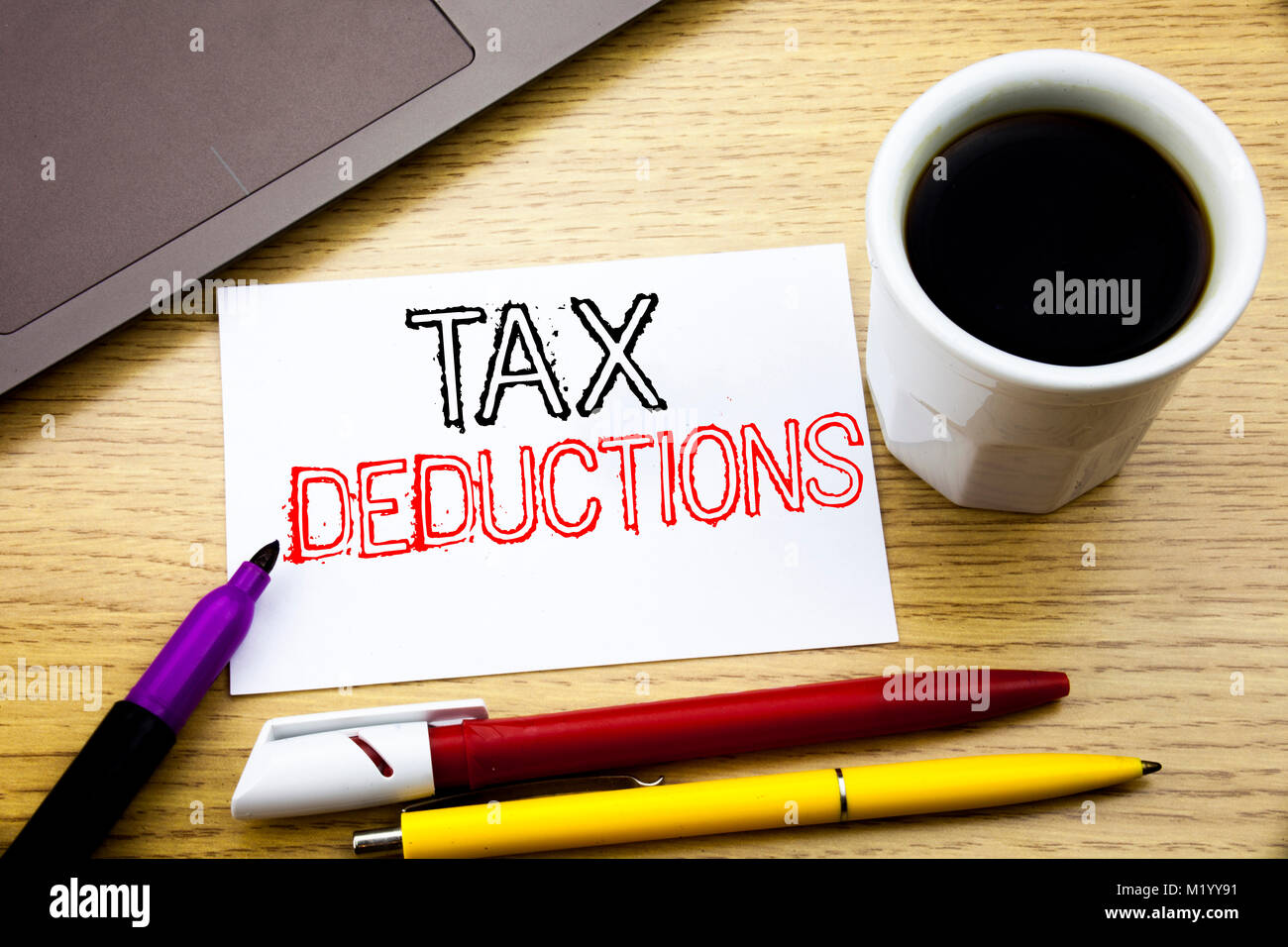Handwritten text caption showing Tax Deductions. Business concept