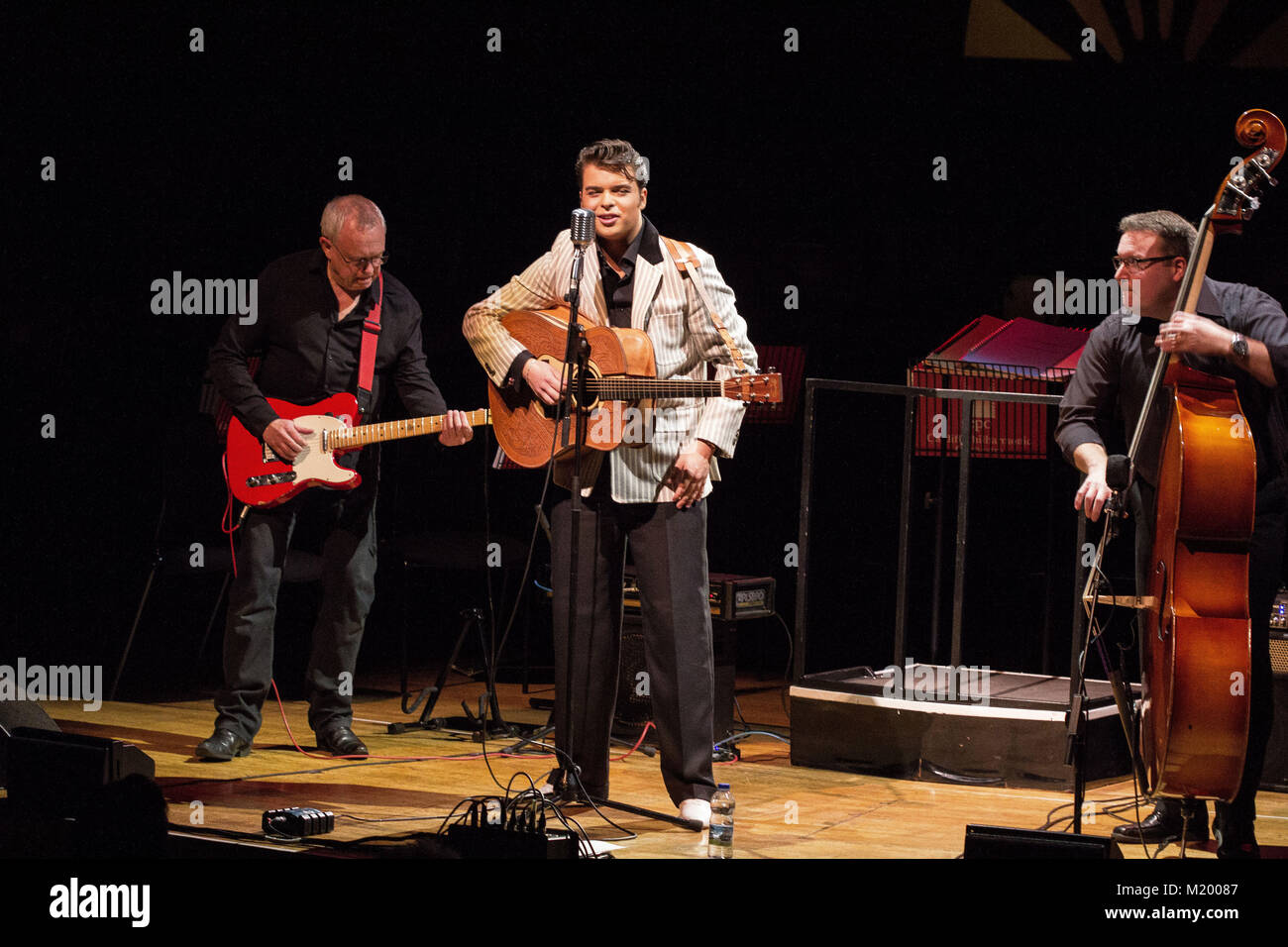 Gordan Davies performing as Elvis Presley at the Elvis Experience concert held at St David’s Hall in central Cardiff. Stock Photo