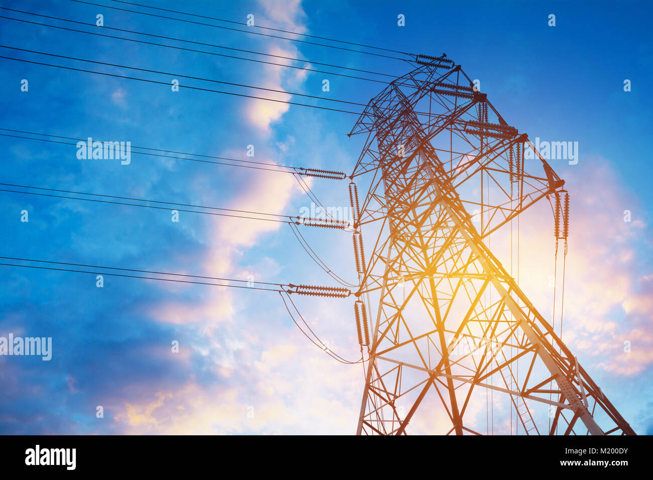 High voltage pole on blue sky background. High voltage tower Stock ...