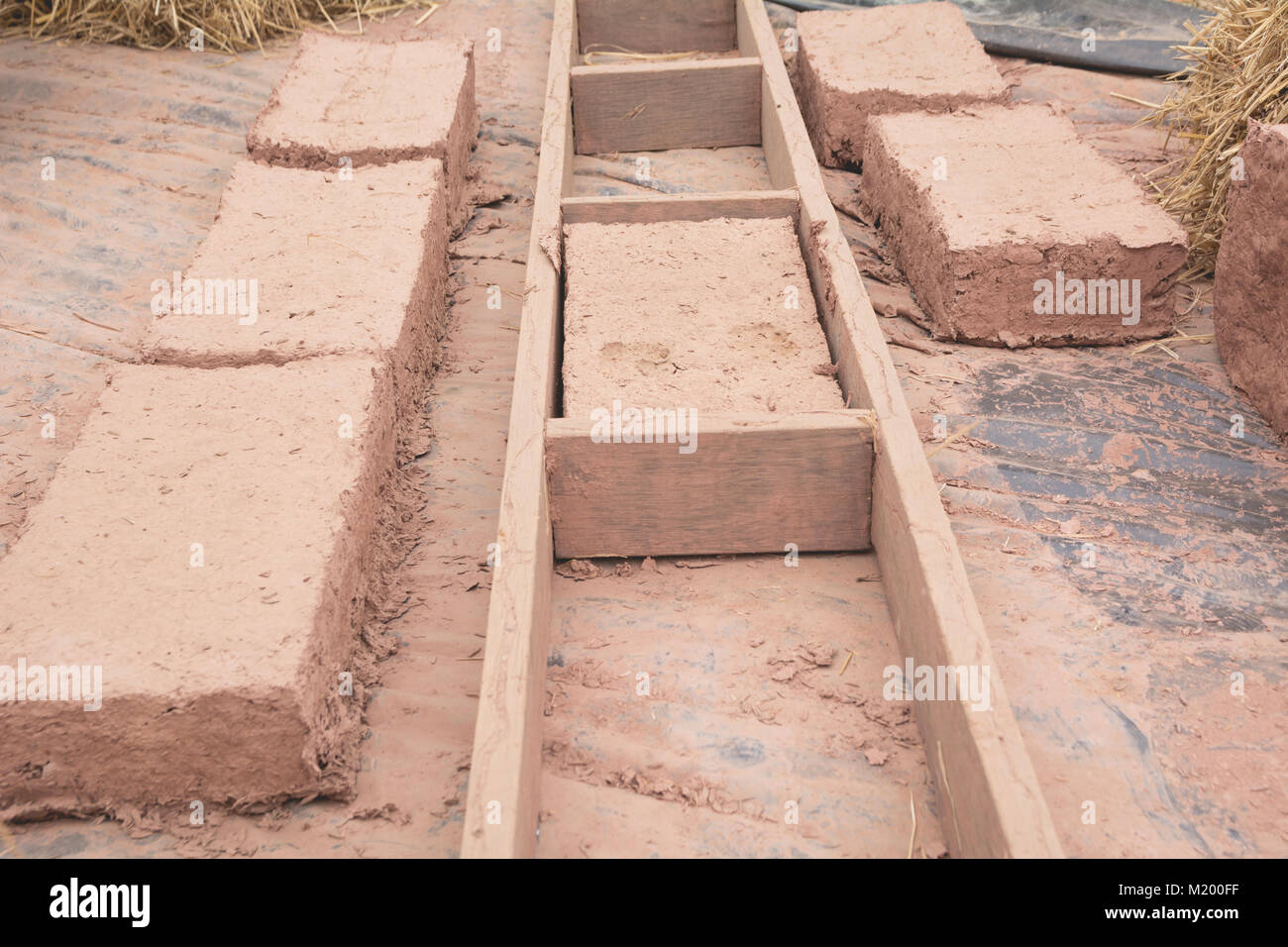 Hand made bricks with clay. Prepare mud for make bricks. Stock Photo