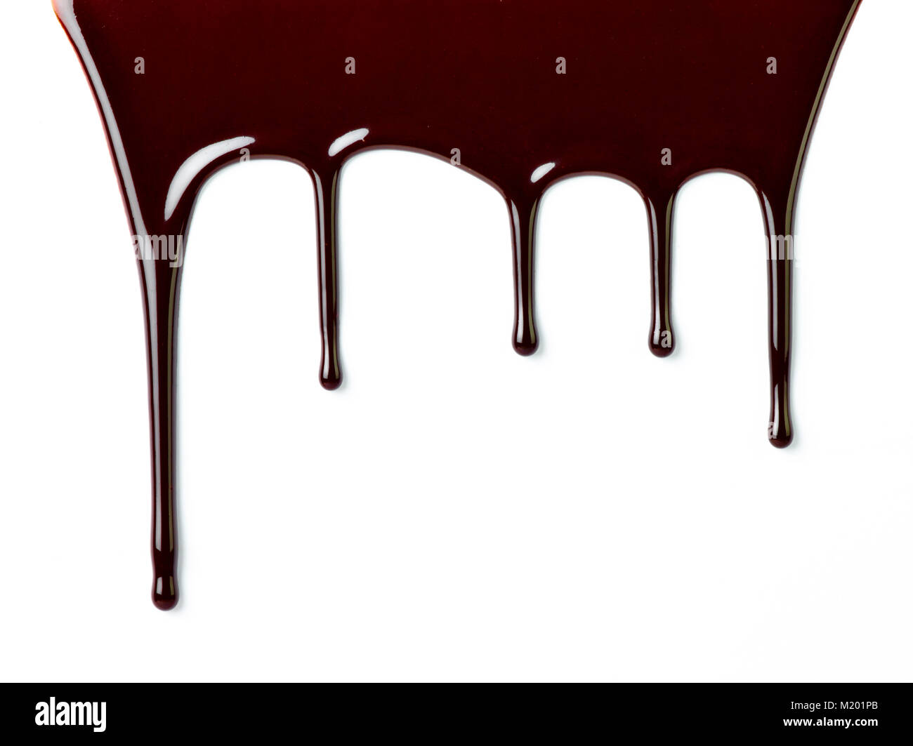 close up of chocolate syrup leaking on white background Stock Photo