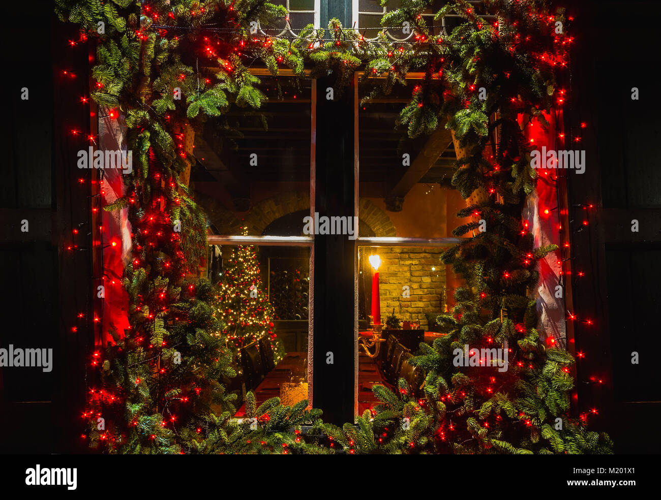 Christmas tree inside house window hires stock photography and images