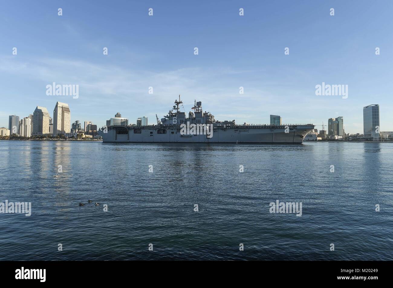 SAN DIEGO (Feb. 2, 2018) The amphibious assault ship USS America (LHA 6) transits San Diego Bay while returning to its Naval Base San Diego homeport following their first operational deployment. America, part of the America Amphibious Ready Group, with embarked 15th Marine Expeditionary Unit, is returning from a regularly scheduled deployment to the Western Pacific and Middle East. The U.S. Navy has patrolled the Indo-Pacific region routinely for more than 70 years promoting peace and security. (U.S. Navy photo by Melissa K. Russell/Released) Stock Photo