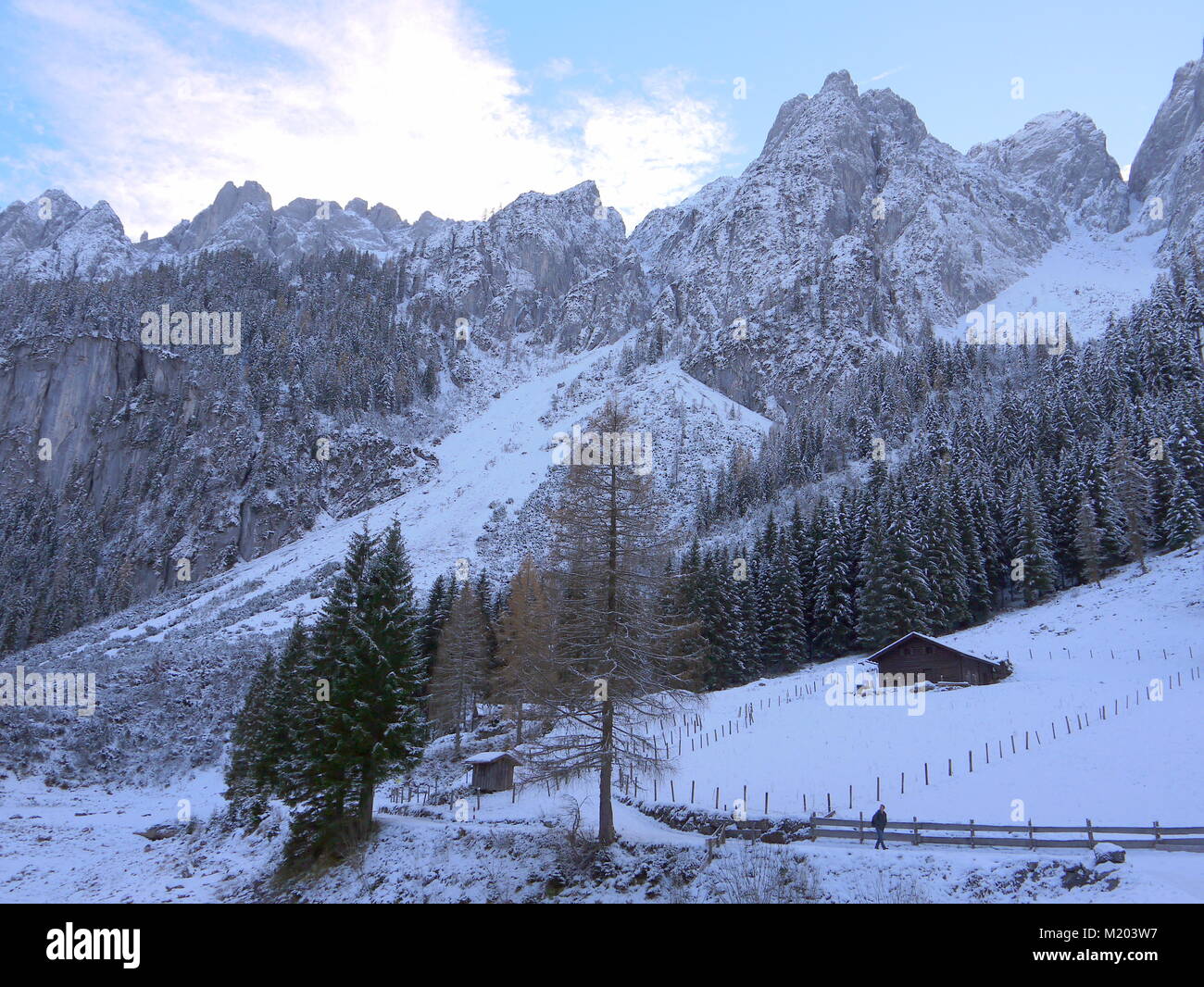 Wonderful winter landscape with view of mountains, forest, little huts ...