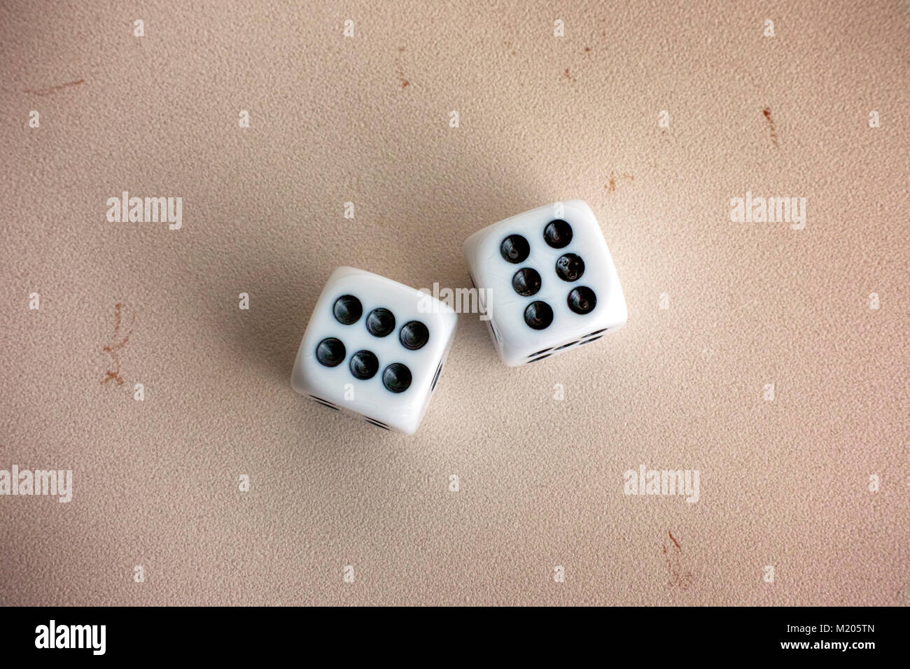 Two dice on stone background. Close-up. Stock Photo