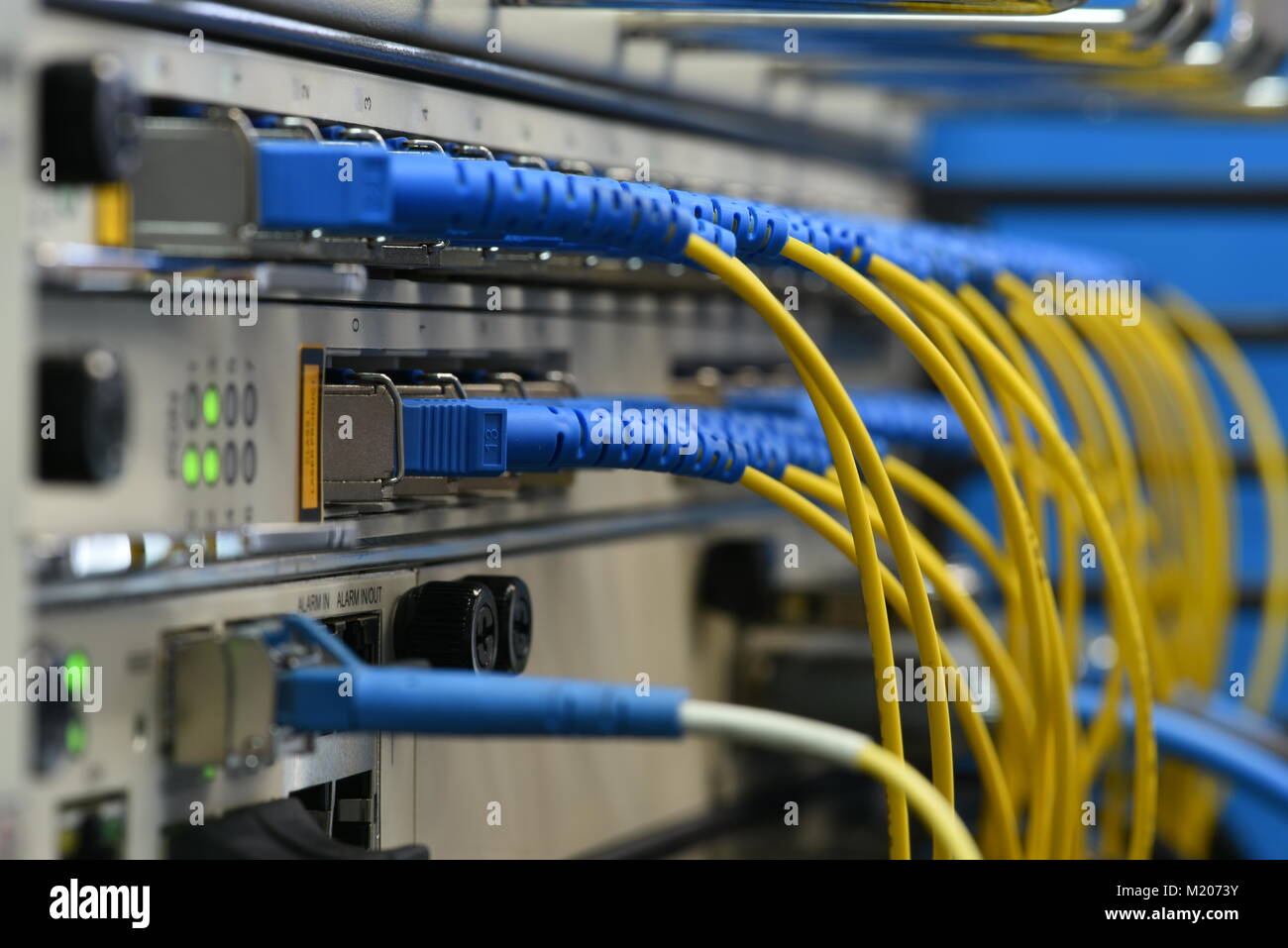 Network devices and optical cables in system Stock