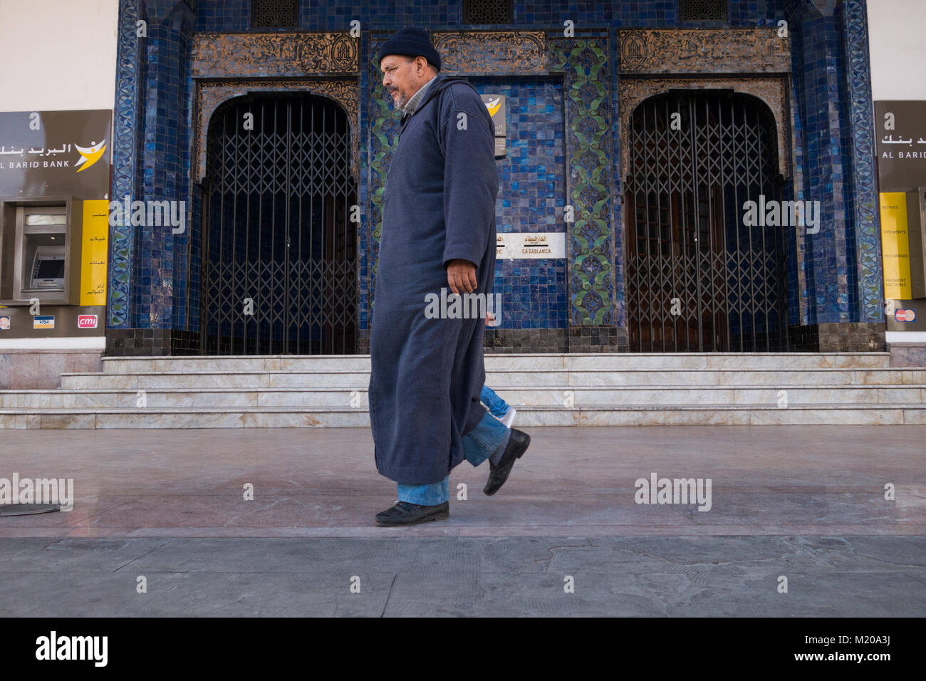 Casablanca, Morocco - 14 January 2018 : local old man walking near the post office wearing a traditional outfit Stock Photo