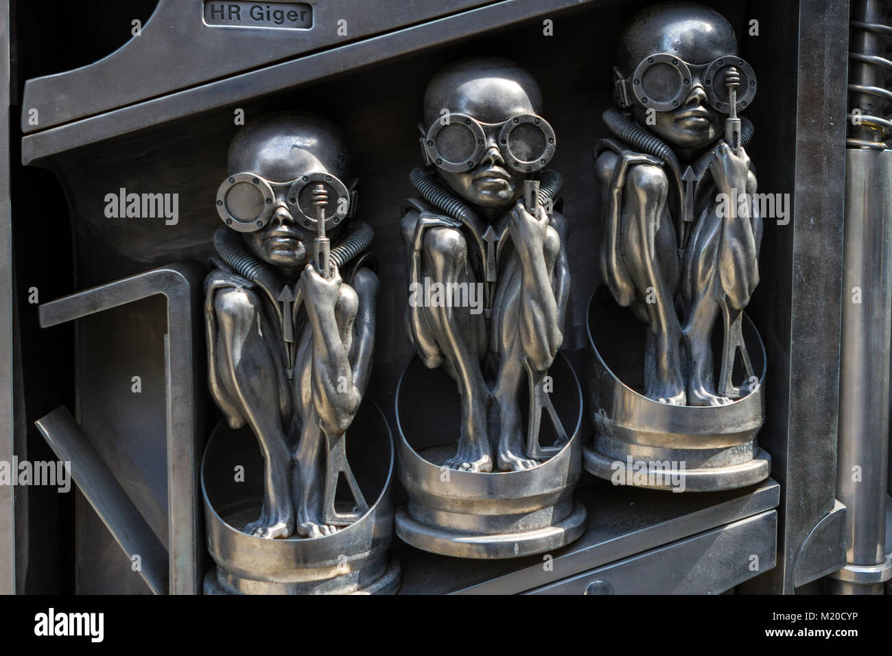 HR Giger birth machine statue in front of Giger museum in Medieval Castle Swiss Village Gruyeres, Switzerland, Europe Stock Photo