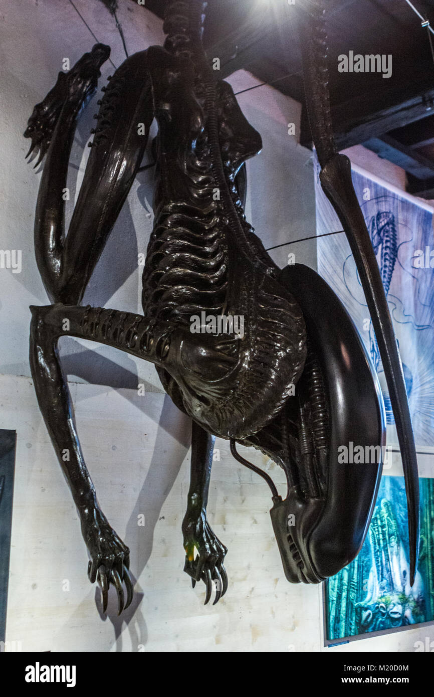 Famous movie SF monster Alien in lobby of HR Giger museum in Medieval Castle Swiss Village Gruyeres, Switzerland, Europe Stock Photo