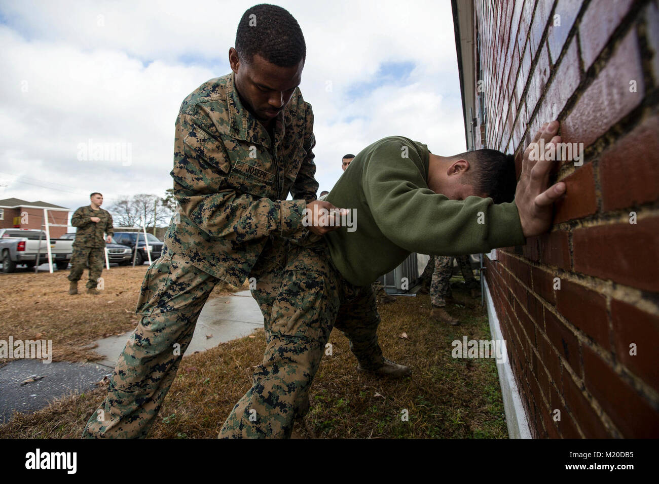 U.S. Marine Lance Cpl. Jean Joseph, left, a rifleman with Battalion Landing Team, 2nd Battalion, 6th Marine Regiment, 26th Marine Expeditionary Unit (MEU), searches a simulated suspect during vehicle-borne improvised explosive device (VBIED) training on Camp Lejeune, N.C., Jan. 11, 2018. The two-day course was held to educate Marines on the proper procedures of inspecting vehicles and civilians for potential threats while also giving them the opportunity to practice techniques in preparation for the upcoming deployment. (U.S. Marine Corps Stock Photo