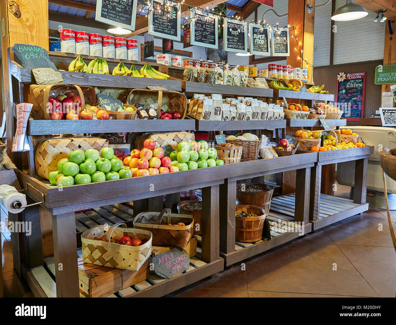 Display shelves in local fresh produce specialty market with organic fruits and vegetables and specialty food in Auburn Alabama, United States. Stock Photo