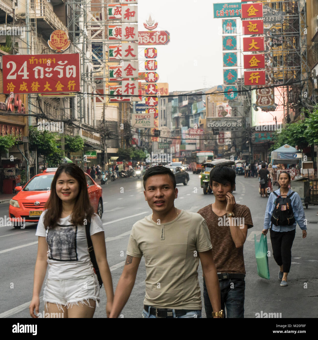People walk on the street of Chinatown in Bangkok, Thailand Stock Photo