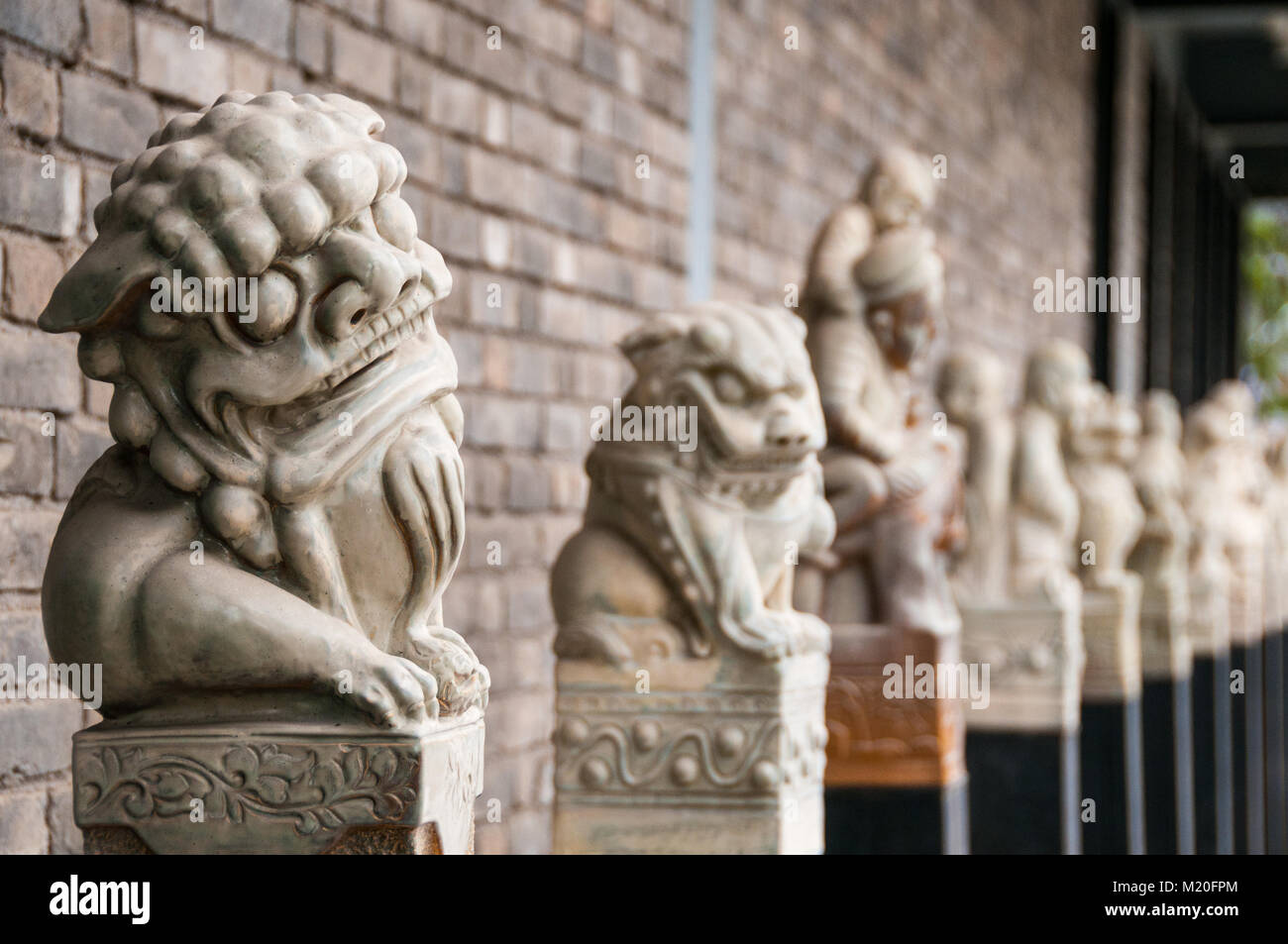 A line of statues similar to those on a sacred way at a tomb seen in the Banpo International Art Zone. Xi’an, Shaanxi Province, China. Stock Photo