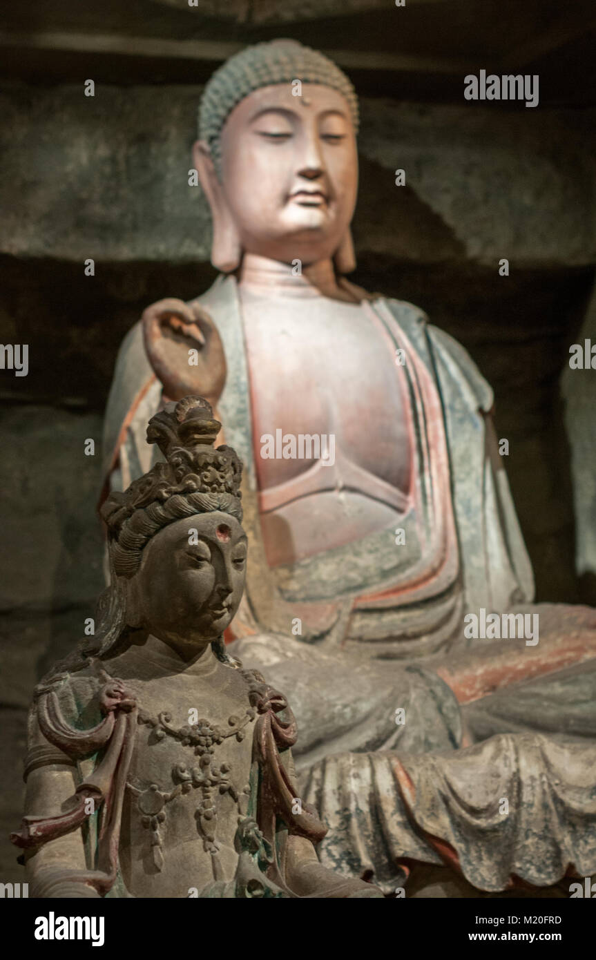 A display of a Buddha statue from the Zhongshan Grotto in Yan’an ...