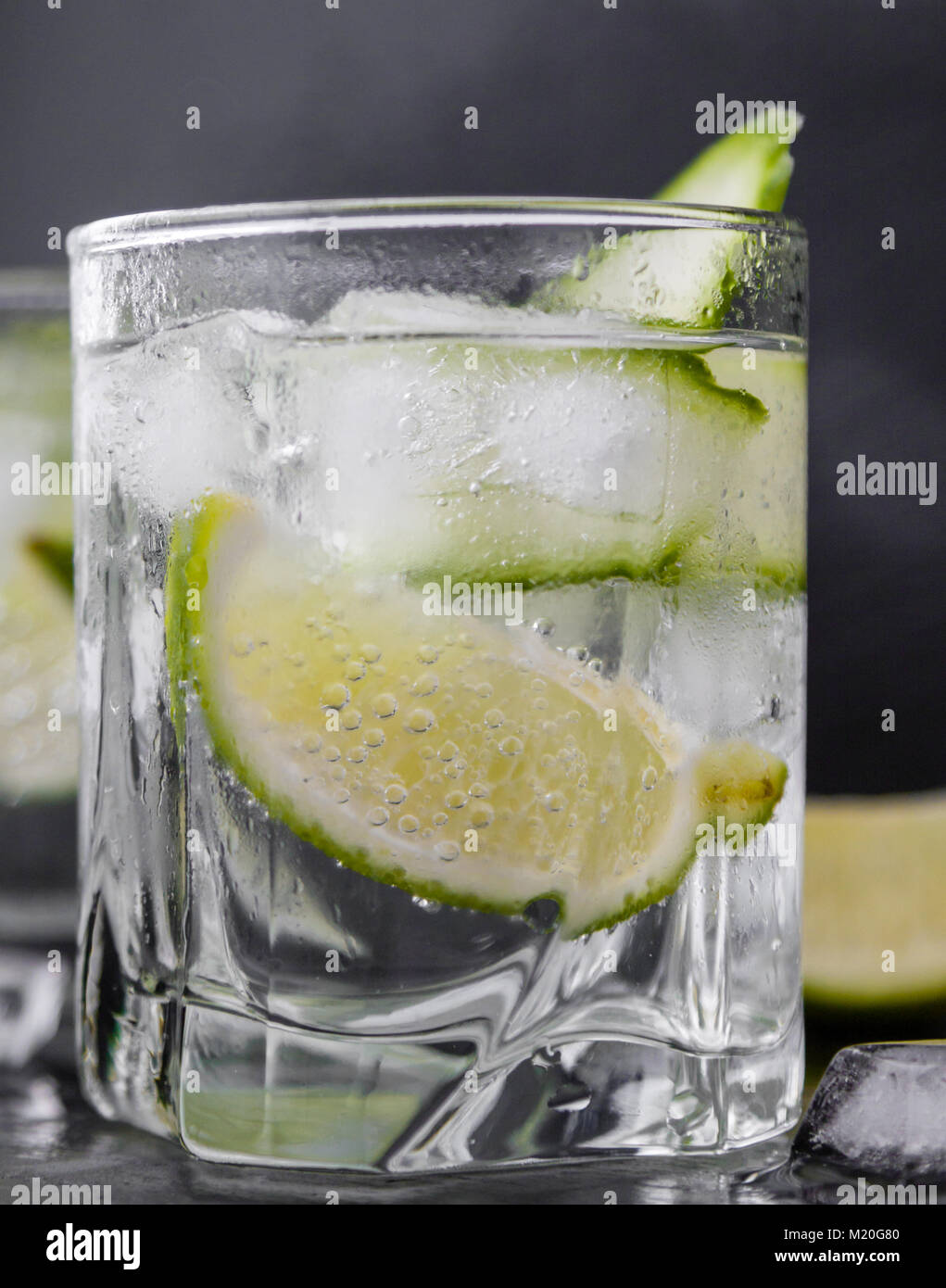 gin tonic with cucumber, lime and ice in glass Stock Photo Alamy