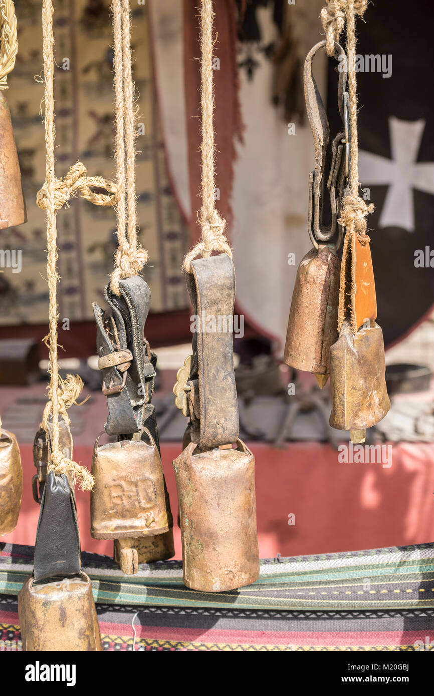 metal and brass cowbells hanging in a medieval stall Stock Photo Alamy
