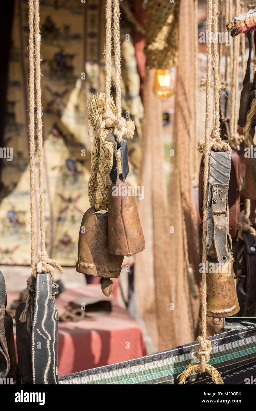 metal and brass cowbells hanging in a medieval stall Stock Photo Alamy