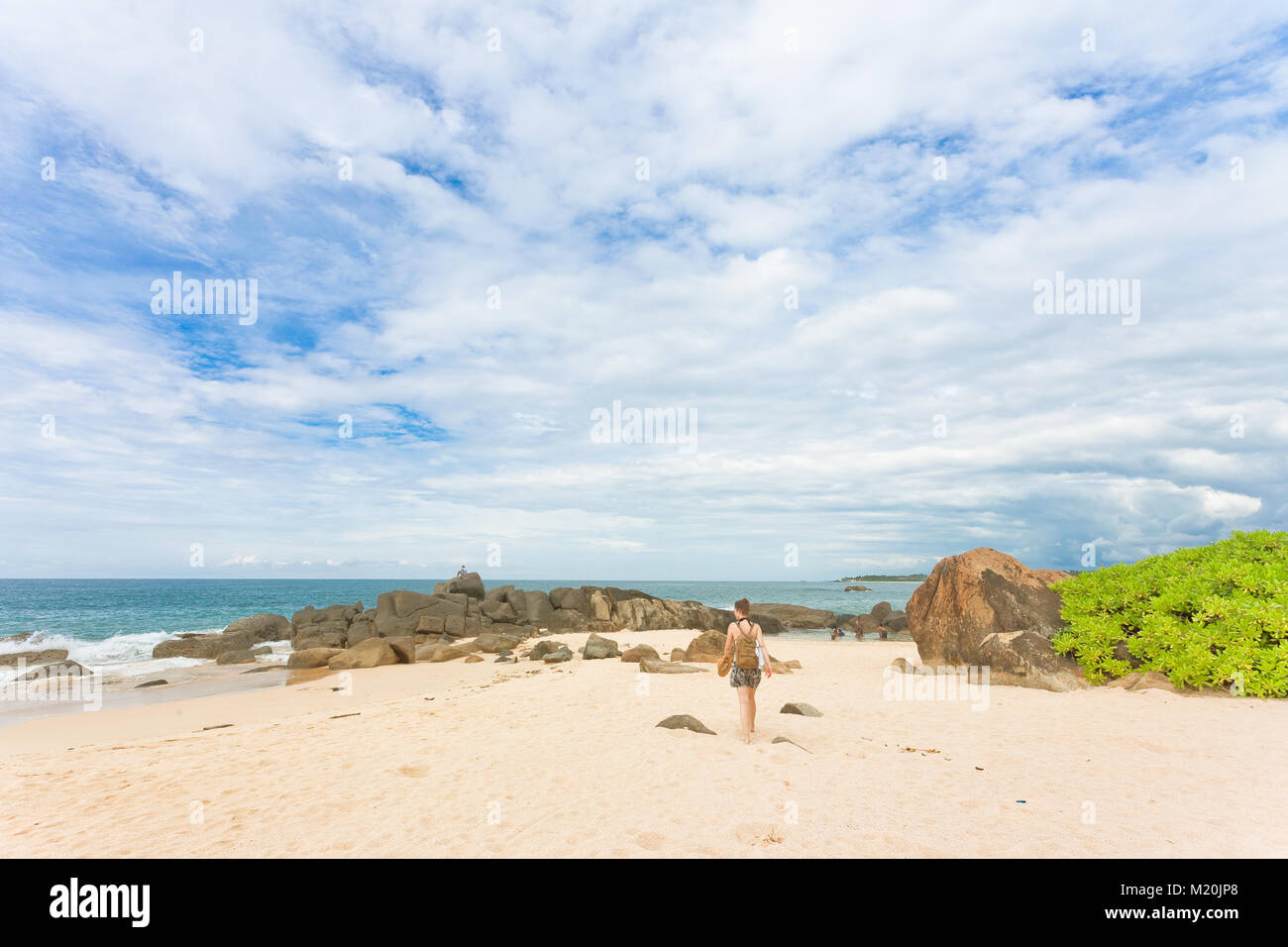Woman walking towards beach hi-res stock photography and images - Alamy