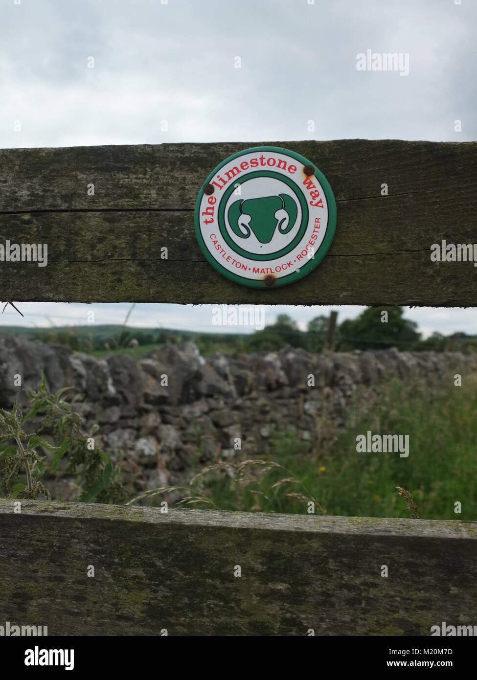 A sign on a gate at Bonsall Moor for the Limestone Way, a long distance ...