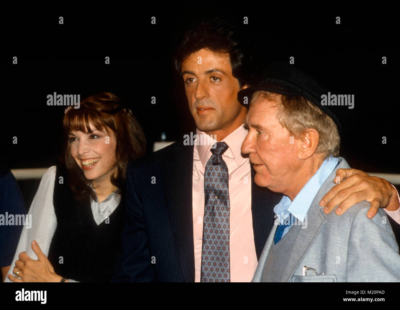 BEVERLY HILLS, CA - MARCH 27: (L-R) Actress Talia Shire, actor Sylvester Stallone and actor Burgess Meredith attend the annual Publicists luncheon at the Beverly Hilton Hotel on March 27,1981 in Beverly Hills, California. Photo by Barry King/Alamy Stock Photo Stock Photo