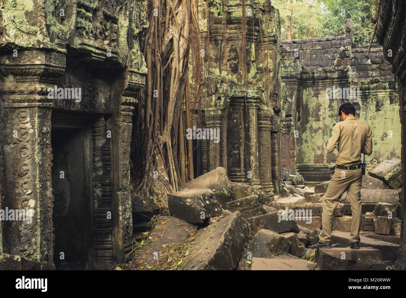 park ranger in Temple ruin, Angkor Wat, Cambodia Stock Photo