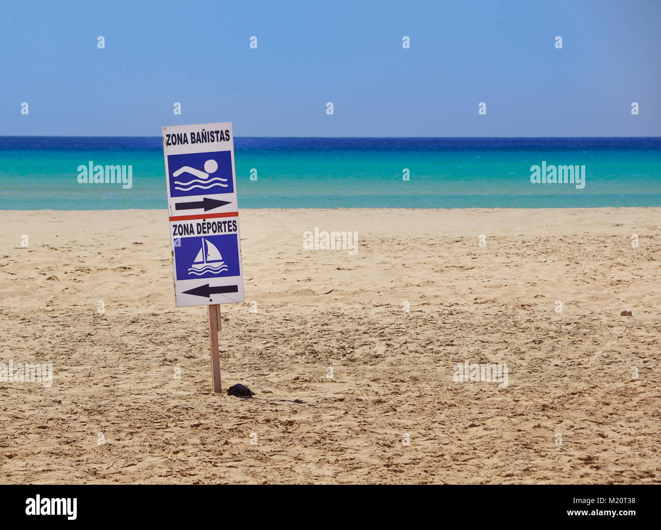 sign of bathing area on the beach for the safety of bathers compared to