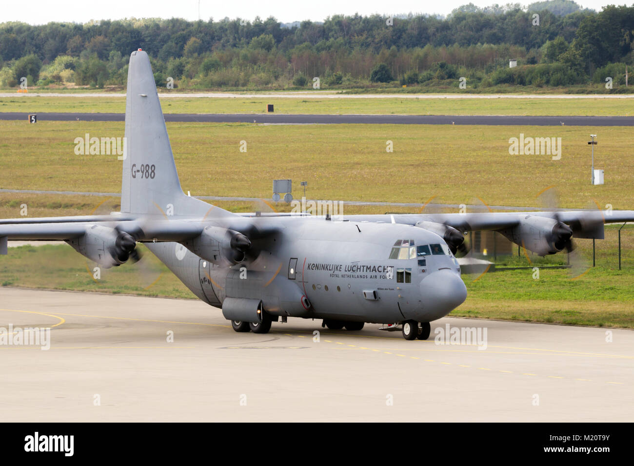 EINDHOVEN, THE NETHERLANDS - SEP 17, 2016: Royal Netherlands Air Force Lockheed C-130 Hercules cargo plane taxiing to the runway of Eindhoven Airport. Stock Photo