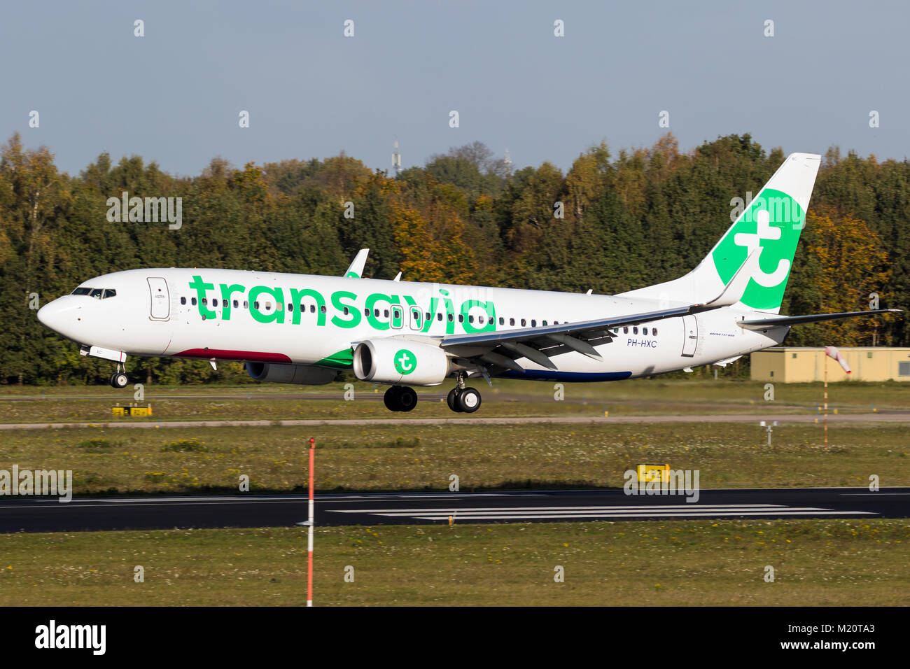 EINDHOVEN, THE NETHERLANDS - OCT 27, 2017: Transavia airlines Boeing 737 airplane landing on Eindhoven Airport. Stock Photo
