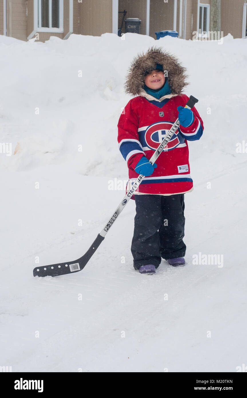 Native girl playing hockey, Northern Quebec Stock Photo