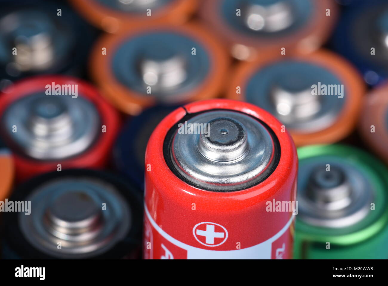 Closeup of alkaline batteries with selective focus on single one Stock Photo
