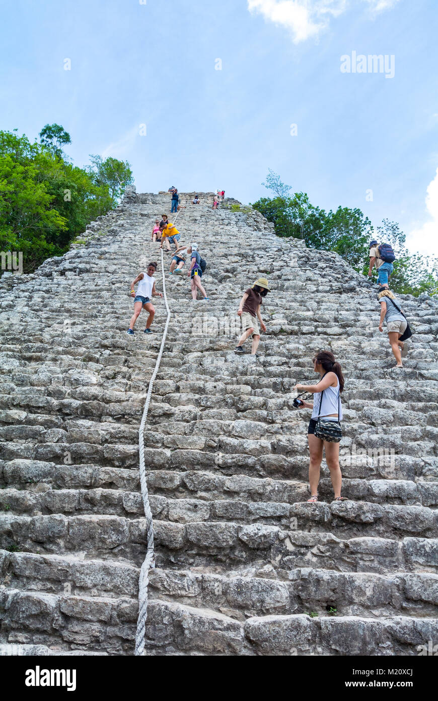 Coba, Quintana Roo, Mexico, Tourists climbing on a pyramide of Coba. Editorial only. Stock Photo