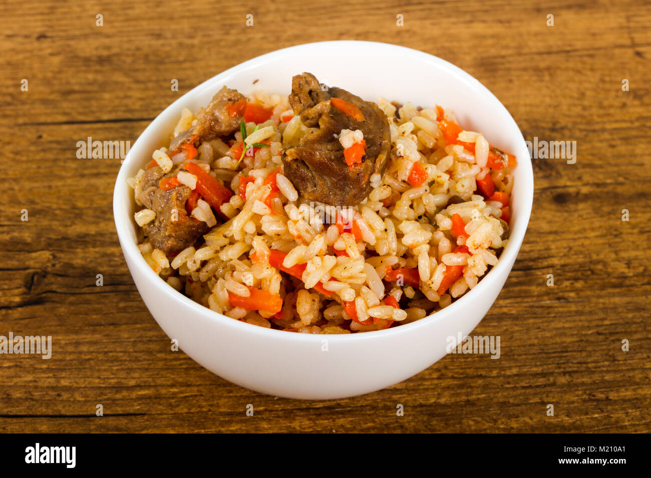 Asian rice - Plov with meat and carrot Stock Photo - Alamy