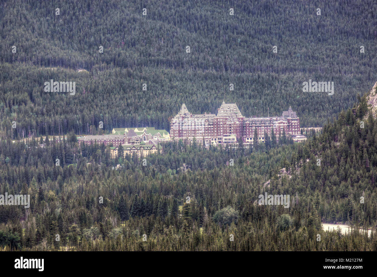 BANFF, CANADA - JULY 9, 2011: Banff Springs Hotel nestled in the ...