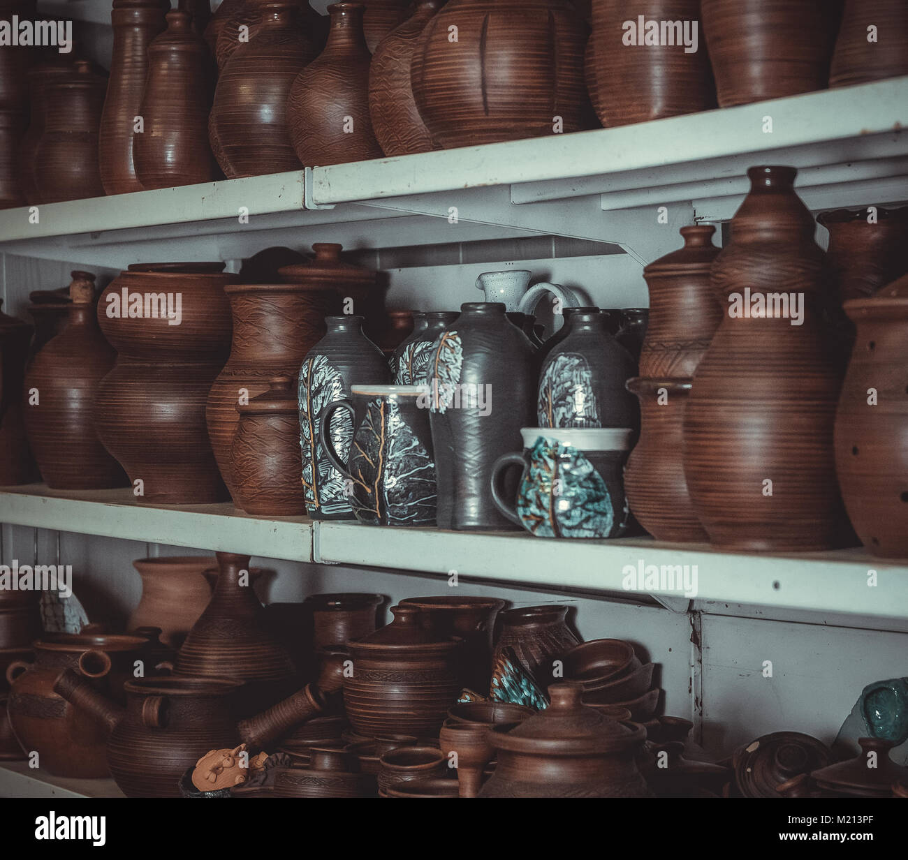 Potter's Racks racks in a pottery workshop with pottery, many different pottery ...