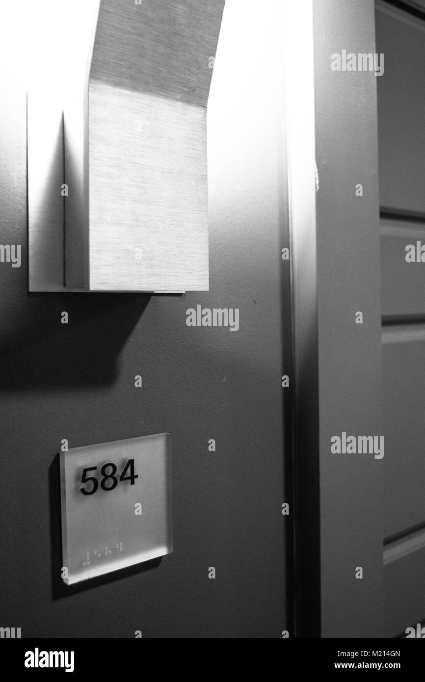 Front door with number in apartment complex Stock Photo