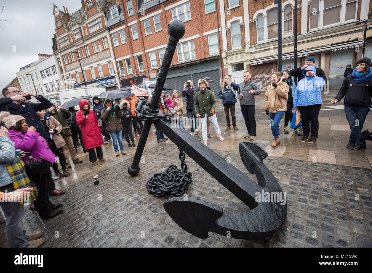London, UK. 3rd Feb, 2018. Local residents celebrate the return of the iconic Deptford Anchor with a celebratory musical procession as the anchor is finally returned to its original place at the south end of Deptford High Street after being removed in 2013 . Credit: Guy Corbishley/Alamy Live News Stock Photo