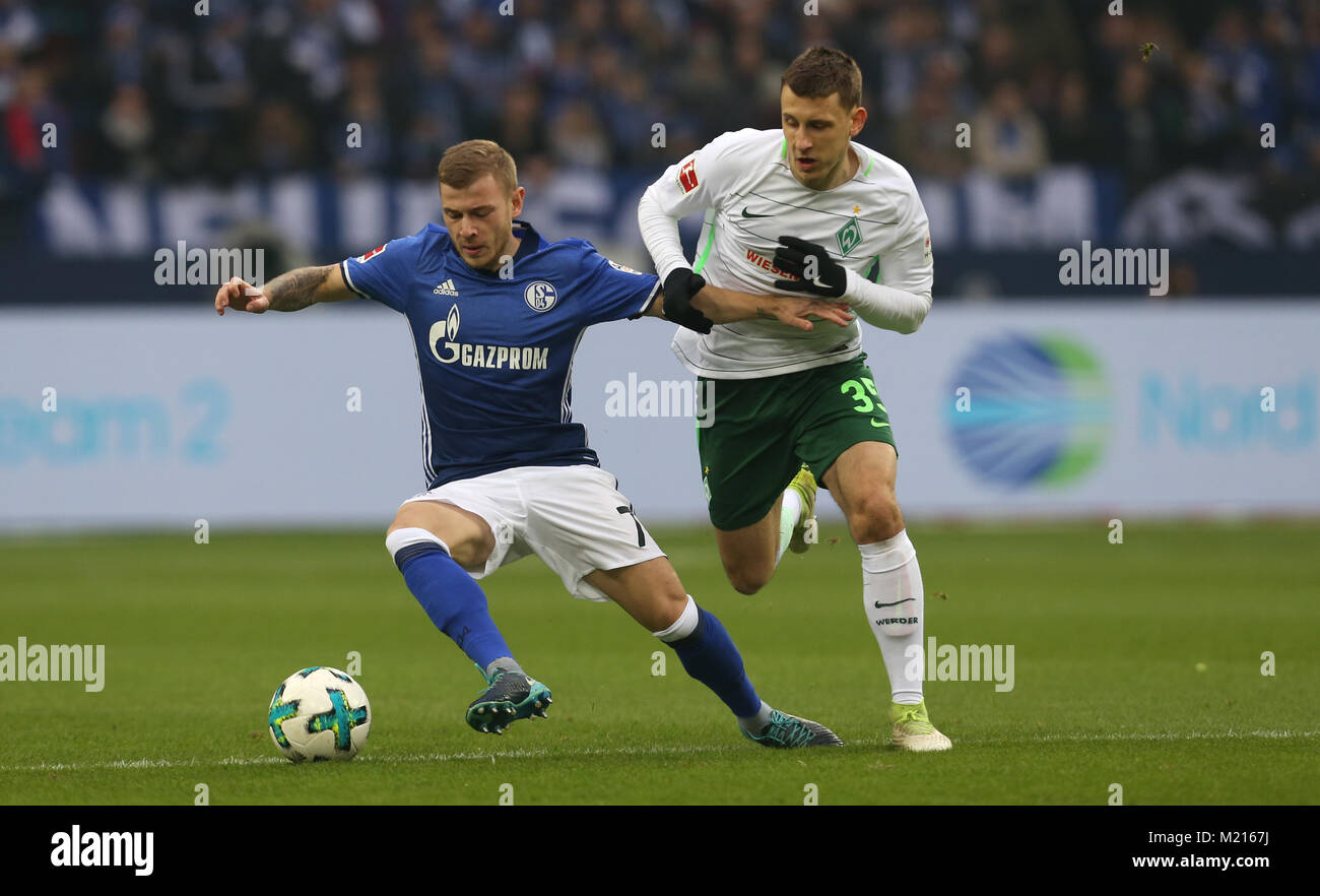 Schalke's Max Meyer and Bremen's Maximilian Eggestein (r) vie for the ball during the German Bundesliga football match between FC Schalke 04 and Werder Bremen at the Veltins Arena in Gelsenkirchen, Germany, 3 February 2018.   (EMBARGO CONDITIONS - ATTENTION: Due to the accreditation guidelines, the DFL only permits the publication and utilisation of up to 15 pictures per match on the internet and in online media during the match.) Photo: Ina Fassbender/dpa Stock Photo