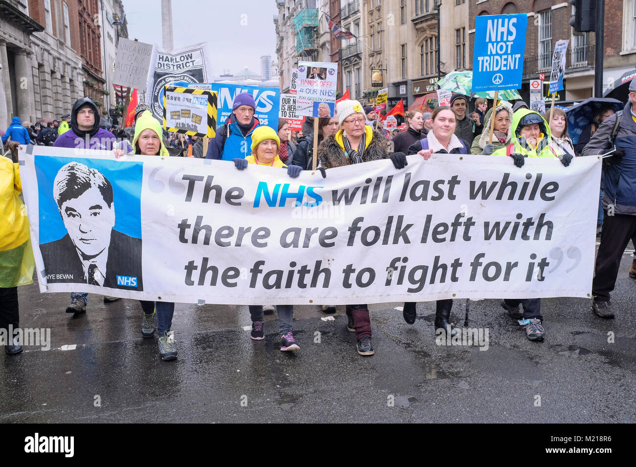 London, UK. 3 February 2018. Thousands of National Health Service workers, union members, activists and supporters march in central London in protest against government cuts in the state health service and the privatisation of medical care. Credit: mark phillips/Alamy Live News Stock Photo