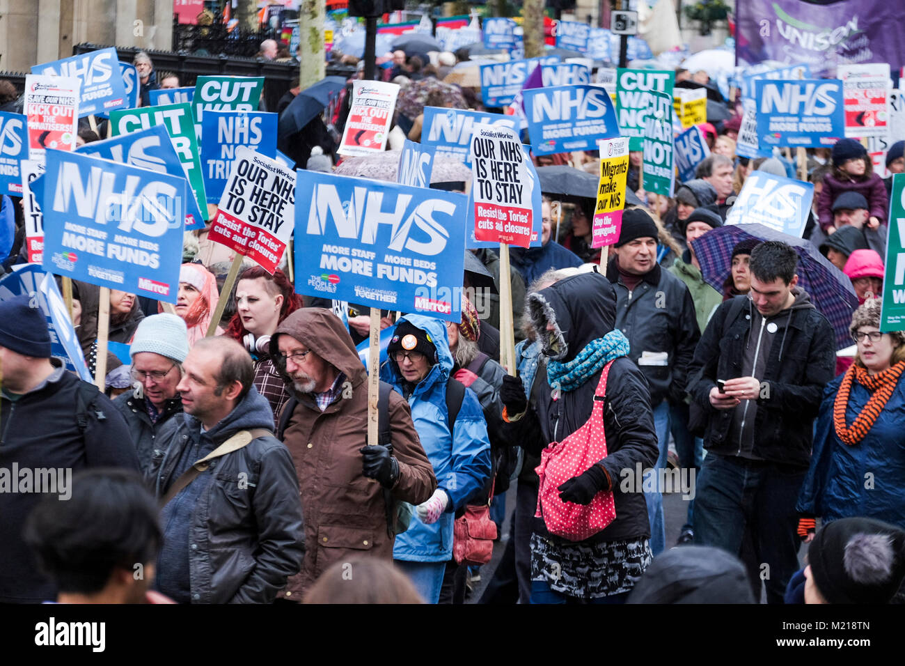 London, UK. 3 February 2018. Thousands of National Health Service workers, union members, activists and supporters march in central London in protest against government cuts in the state health service and the privatisation of medical care. Credit: mark phillips/Alamy Live News Stock Photo