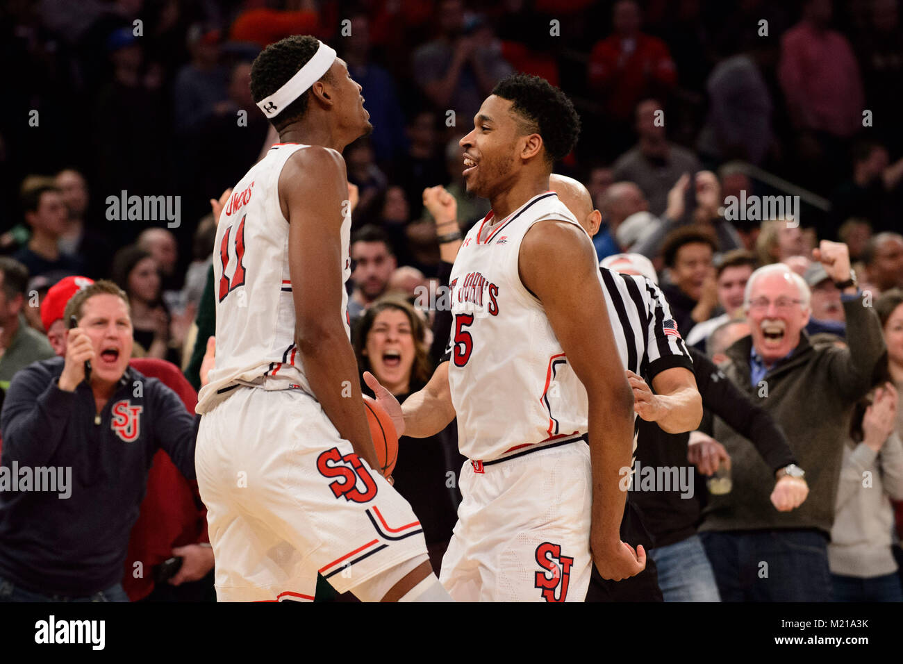 February 03, 2018: St. John's Red Storm guard Justin Simon (5) and St. John's Red Storm forward Tariq Owens (11) celebrate after the game between The Duke Blue Devils and St. John's Red Storm at Madison Square Garden, New York, New York. The St. John's Red Storm upset The Duke Blue Devils 81-77. Mandatory credit: Kostas Lymperopoulos/CSM Stock Photo