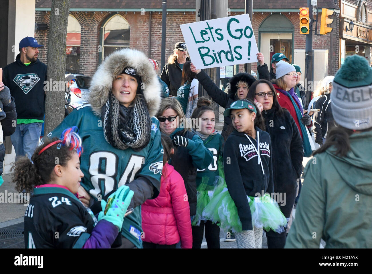 Media, PA, USA, Thousands of Philadelphia Eagles fans line the streets of Media for a rally supporting the NFC Championship Philadelphia Eagles in their pursuit of winning the NFL Super Bowl. Media, Delaware County, PA is located approximately 14 miles South of Philadelphia, PA. Temperatures in the mid 20 degree range (fahrenheit) Credit: Don Mennig/Alamy Live News Stock Photo
