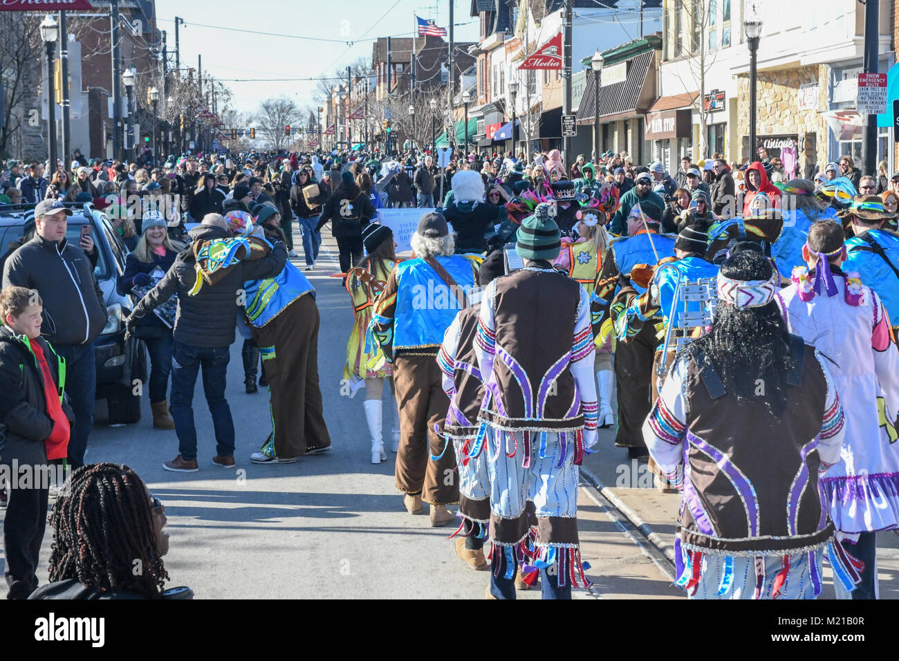Media, PA, USA, Thousands of Philadelphia Eagles fans line the streets of Media for a rally supporting the NFC Championship Philadelphia Eagles in their pursuit of winning the NFL Super Bowl. A mummers string band entertains pep rally attendees | Media, Delaware County, PA is located approximately 14 miles South of Philadelphia, PA. Temperatures in the mid 20 degree range (fahrenheit) Credit: Don Mennig/Alamy Live News Stock Photo