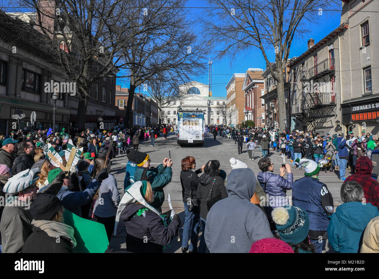 Media, PA, USA, Thousands of Philadelphia Eagles fans line the streets of Media for a rally supporting the NFC Championship Philadelphia Eagles in their pursuit of winning the NFL Super Bowl. Media, Delaware County, PA is located approximately 14 miles South of Philadelphia, PA. Temperatures in the mid 20 degree range (fahrenheit) Credit: Don Mennig/Alamy Live News Stock Photo