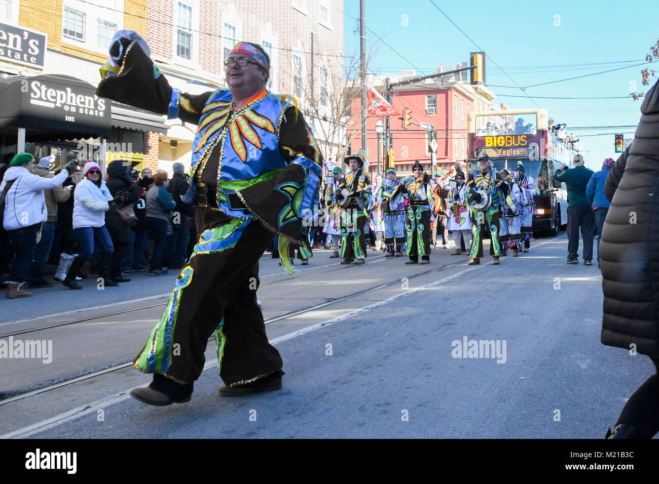 Media, PA, USA, Thousands of Philadelphia Eagles fans line the streets of Media for a rally supporting the NFC Championship Philadelphia Eagles in their pursuit of winning the NFL Super Bowl. A mummers string band entertains pep rally attendees | Media, Delaware County, PA is located approximately 14 miles South of Philadelphia, PA. Temperatures in the mid 20 degree range (fahrenheit) Credit: Don Mennig/Alamy Live News Stock Photo