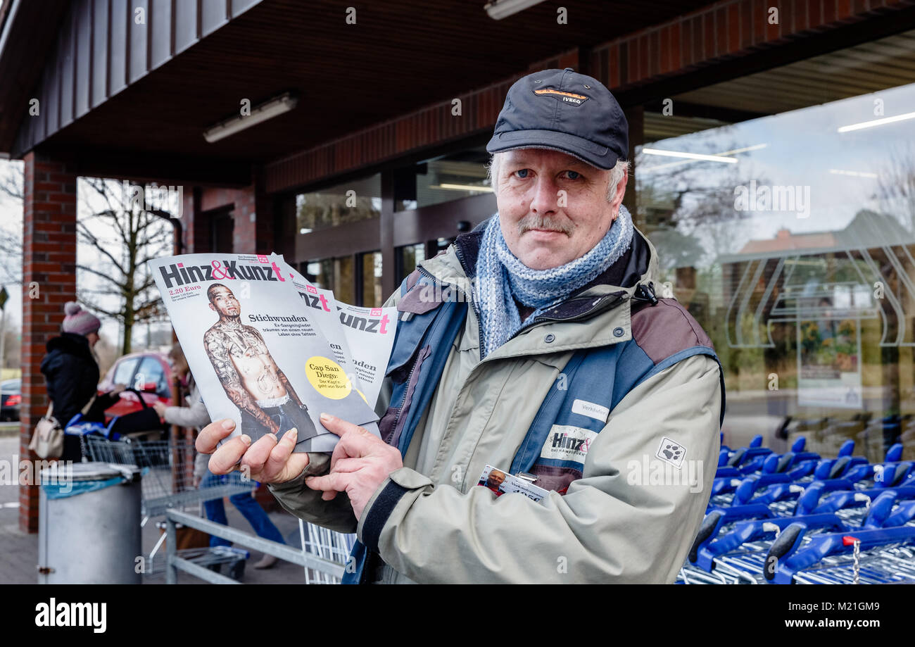 The formerly homeless Joerg Petersen, selling the street paper Hinz&Kunzt in front of an Aldi supermarket in Hamburg, Germany, 01 Febuary 2018. Petersen collected 80000 signatures with an online petition for the opening of emergency winter programmes for the homeless during the daytime. Photo: Markus Scholz/dpa Stock Photo