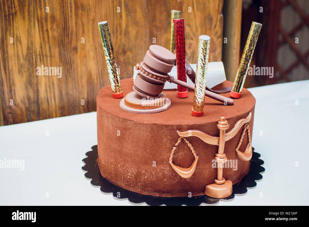 Bride and groom cake topper couple with legal gavel Stock Photo Alamy