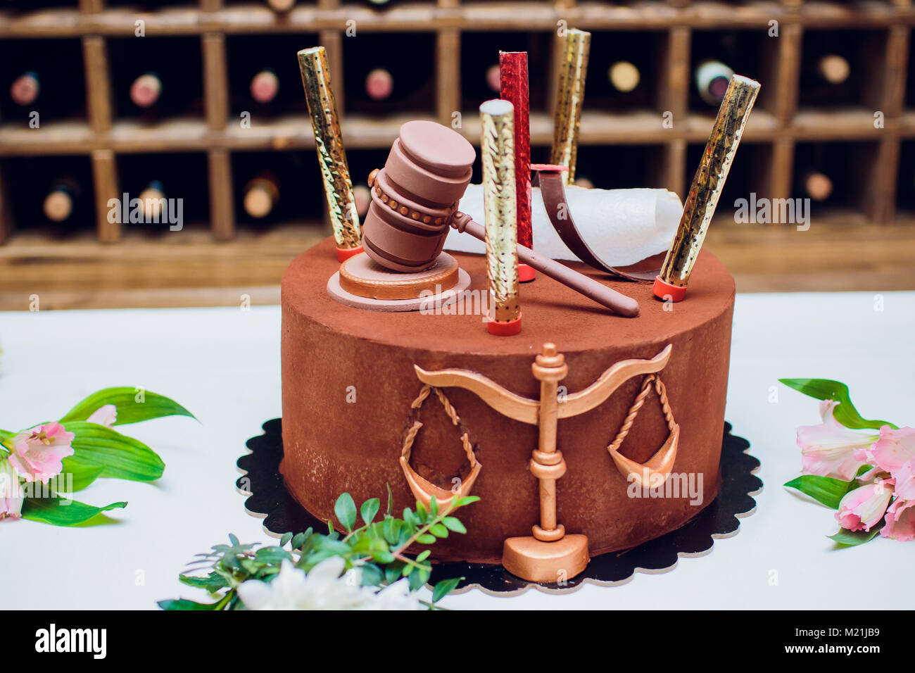 Bride and groom cake topper couple with legal gavel Stock Photo Alamy