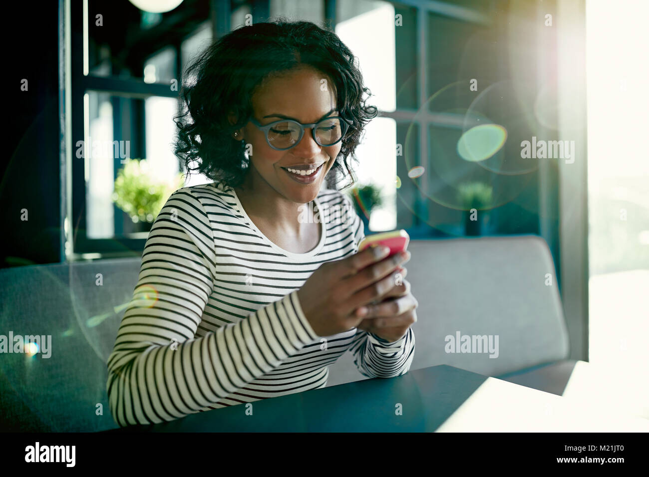 African american woman sending hi-res stock photography and images - Alamy